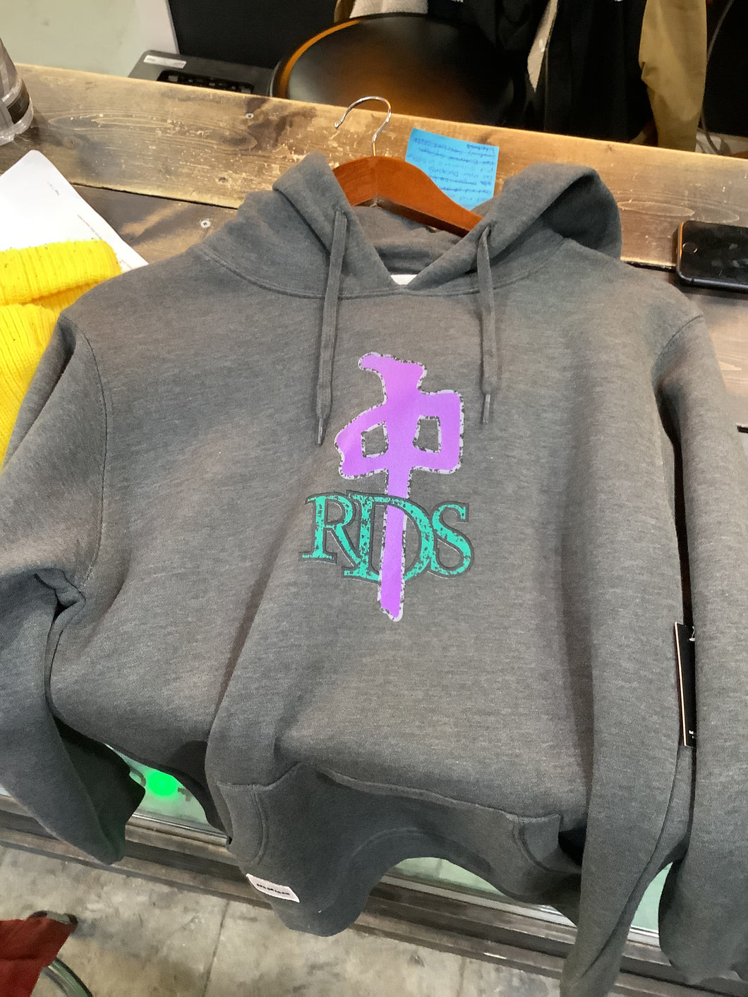 RDS hoodie dark grey. Purple and green logo